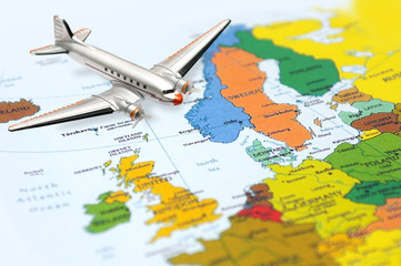 Fototapeta na wymiar Fly to Europe - airplane at the background of the Europe map