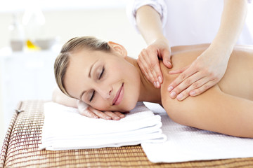 Obraz na płótnie Canvas Caucasian young woman enjoying a back massage