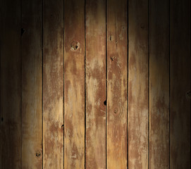 Naklejka premium Distressed wooden surface lit dramatically