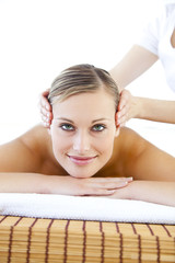 Obraz na płótnie Canvas Happy young woman receiving a head massage