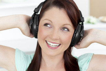 Animated young woman listen to music wearing headphones