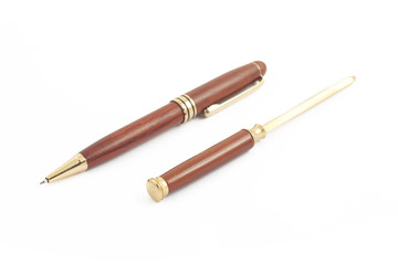 Fototapeta premium Pen and knife for envelopes on white