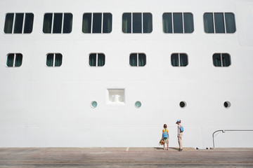 boy and girl near white passenger liner at dock © Pavel Losevsky
