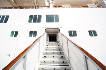 entrance with rails and stairs in white passenger liner