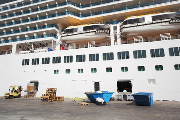 white passenger liner loading at dock summer day