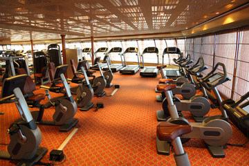 gym hall with treadmills and exercise bicycle in cruise ship