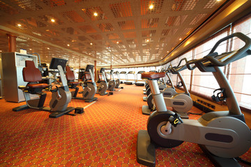 large gym hall with exercise bicycle in cruise ship general view