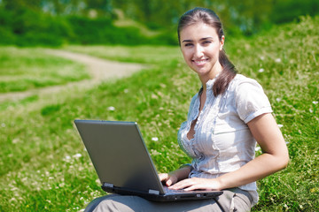 Beautiful woman with notebook on hill