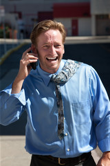 Pleased, good-looking guy talks on cell phone.