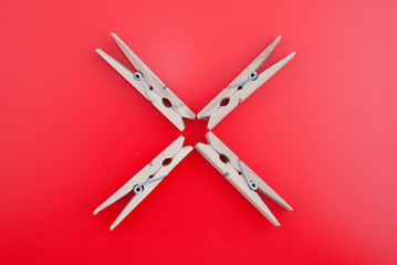 Cross made of wooden clothes pegs