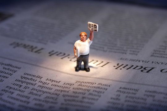 Newspaper Seller Figurine