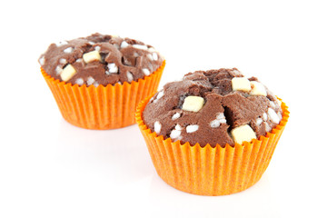 brown home baked cupcake with chocolate pieces