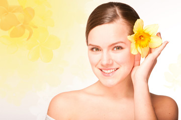 Portrait Beautiful girl with flower. Focus on eyes