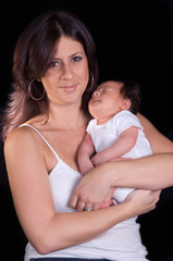 Beautiful mother holding her newborn baby boy