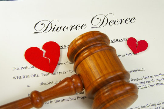 broken red hearts and legal gavel on divorce papers