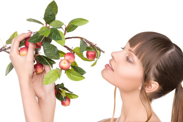 lovely woman with apple twig