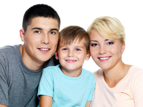 Happy faces of  young smiling family  - On white background