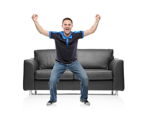 A view of a happy sport fan against white background