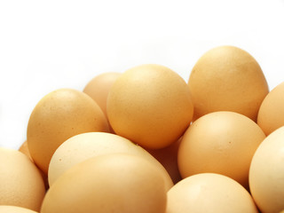 Eggs in a small basket isolated on white background