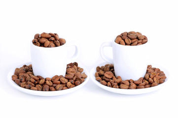 two coffee cups filled with coffee beans