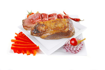 served meat chunk with rolls  on white