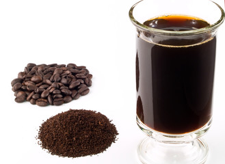 Coffee Beans Coffee Grounds and a Cup of Brewed Coffee