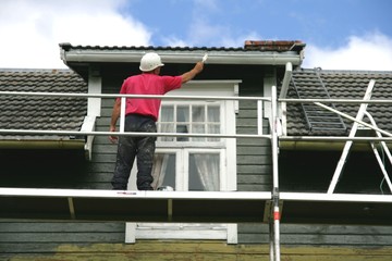 Man painting his house