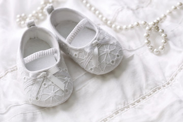 Baby girl shoes on white background