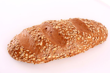 Bread with sunflower seeds isolated on white