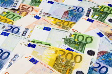 Euro banknotes isolated on a white background.