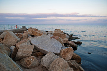 Sunset on the Baltic sea coast with stones