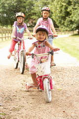Fototapeta premium Children In Countryside Wearing Safety Helmets