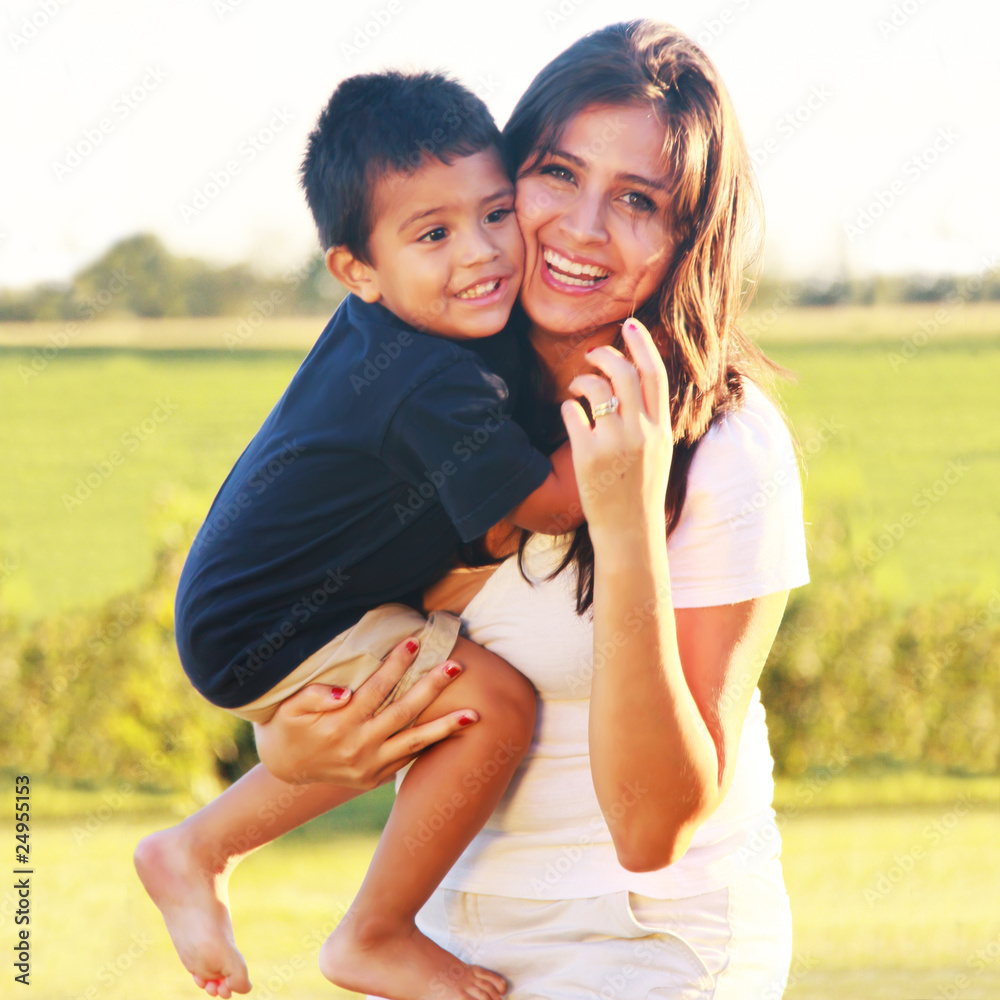 Wall mural mother holding toddler child laughing