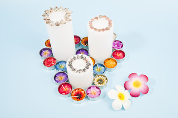 Three candles with flowers