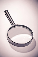 Magnifying glass on white background