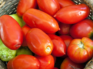 Fototapeta na wymiar Tomatoes and peppers in basket