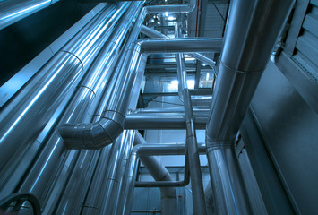 Equipment, cables and piping as found inside of a modern industr