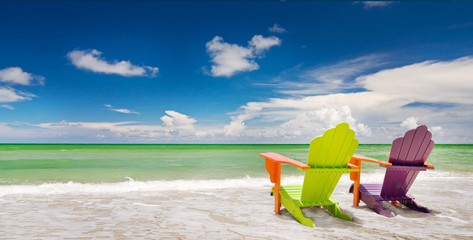 Colorful chairs at a trpoical beach in Miami Florida