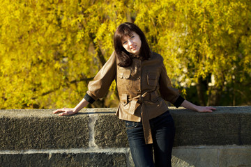 Fototapeta na wymiar beautiful young woman standing on the bridge