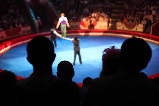 blue arena in circus performance with acrobat