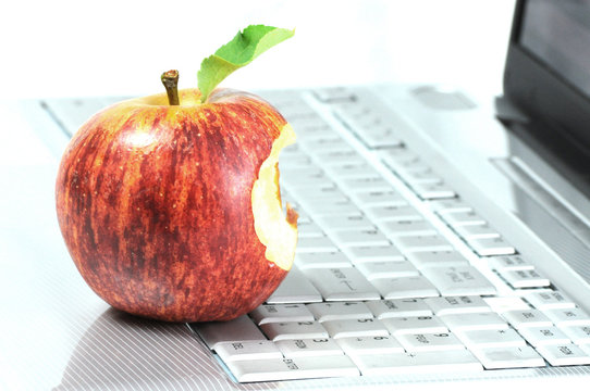 Laptop and bitten apple