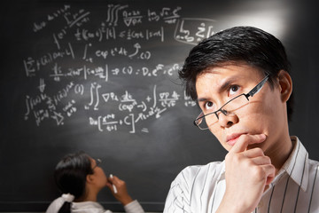 Male student pose  with people working on background