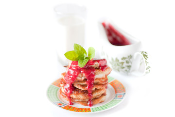 Pancakes with fresh raspbery sauce and mint