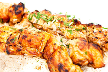 closeup of grilled chicken with rice isolated
