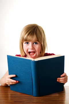 child shocked at book