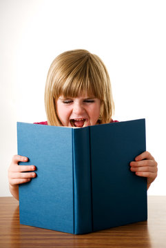 child shouting at book