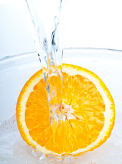 orange into water splash