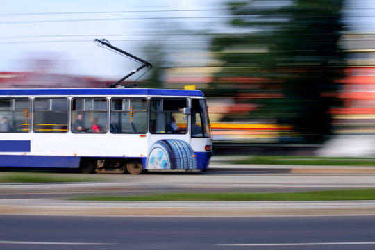 Blue tram rider fast on rails, Wroclaw, Poland