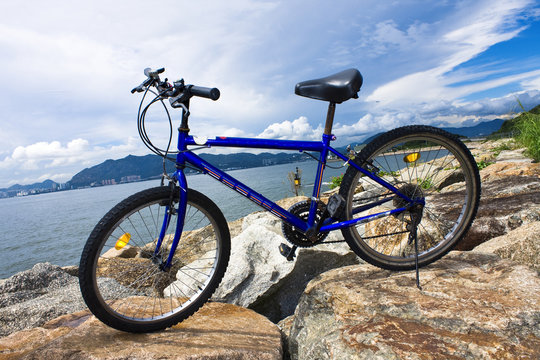 bike in the sea bay and blue sky