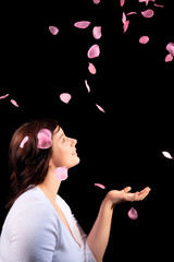 Young girl with rose petals